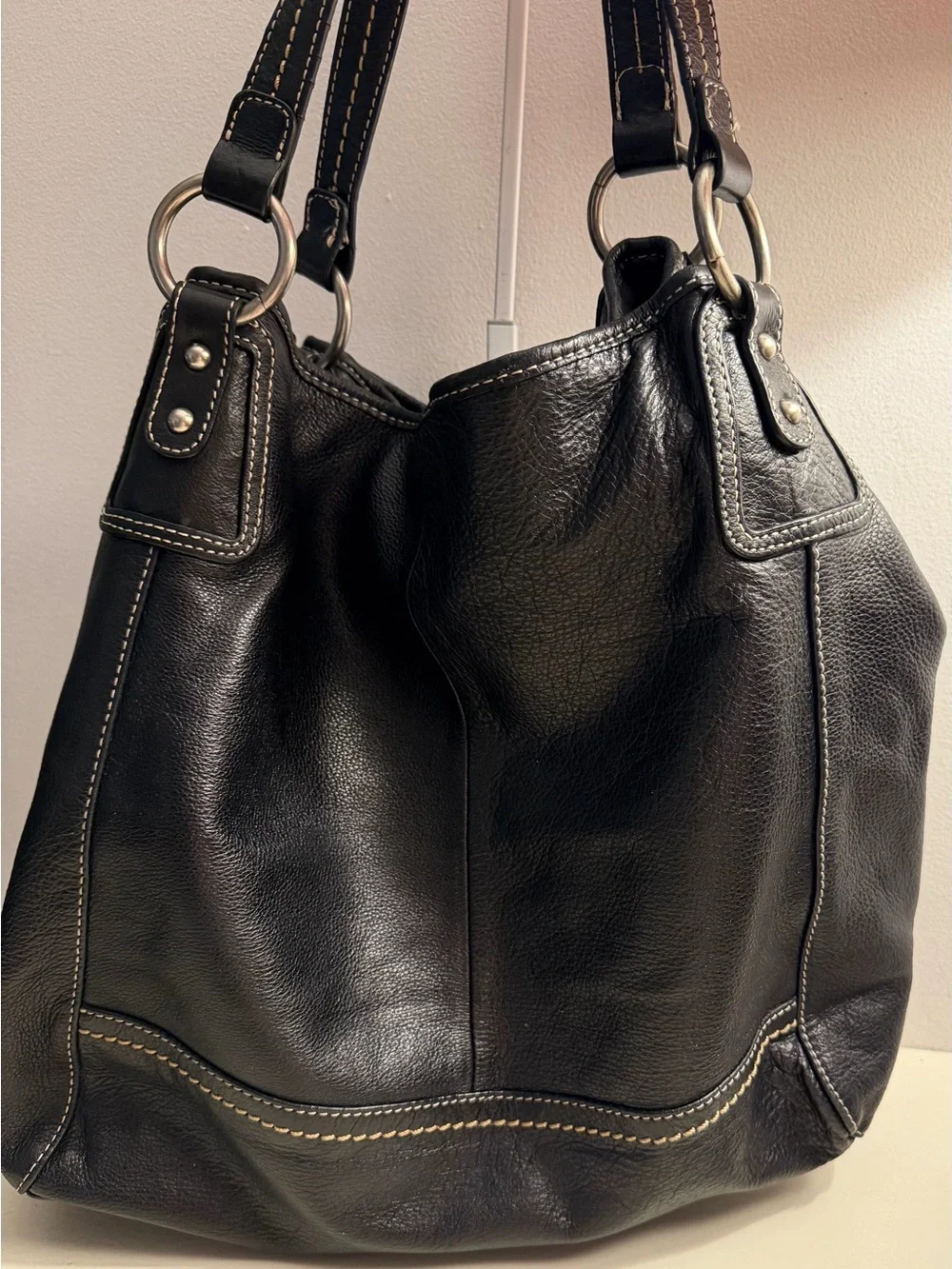 The Sak “PO Asbury” large pebbled black leather hobo/shoulder bag.